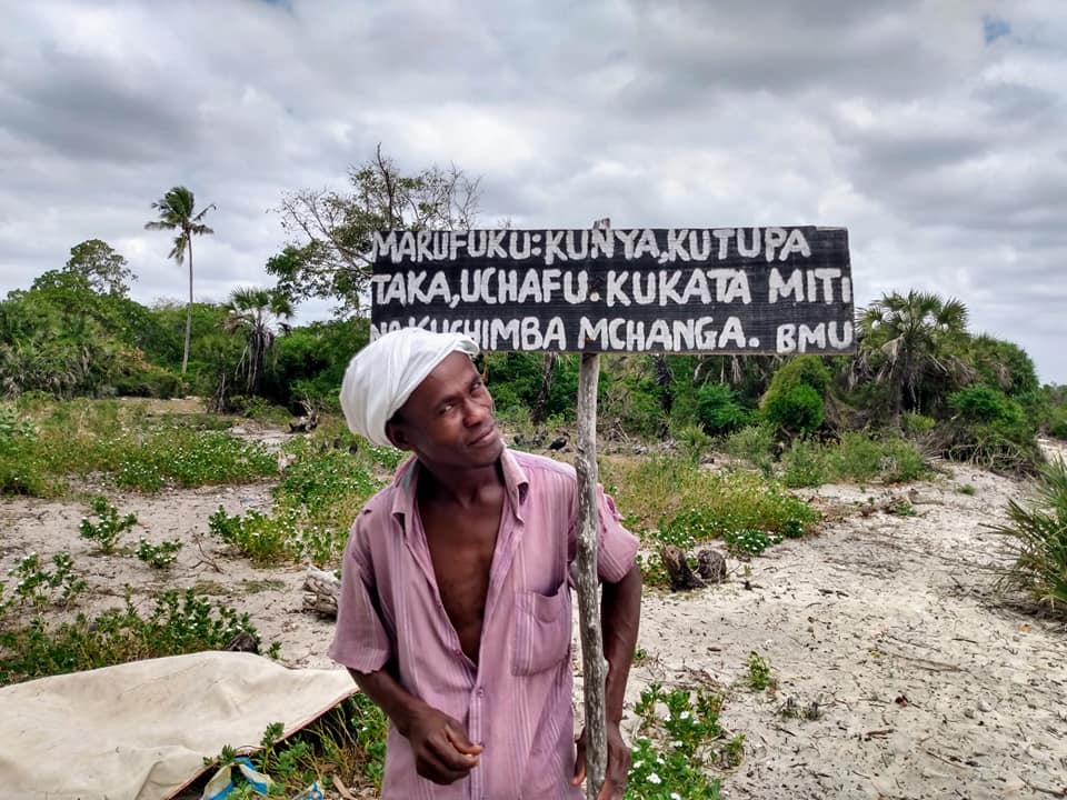 Leader with Beach Management Unit sign